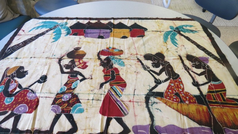 “African Village” Batik Fabric Wall Art 56” x 38”, brown border, off-white back
